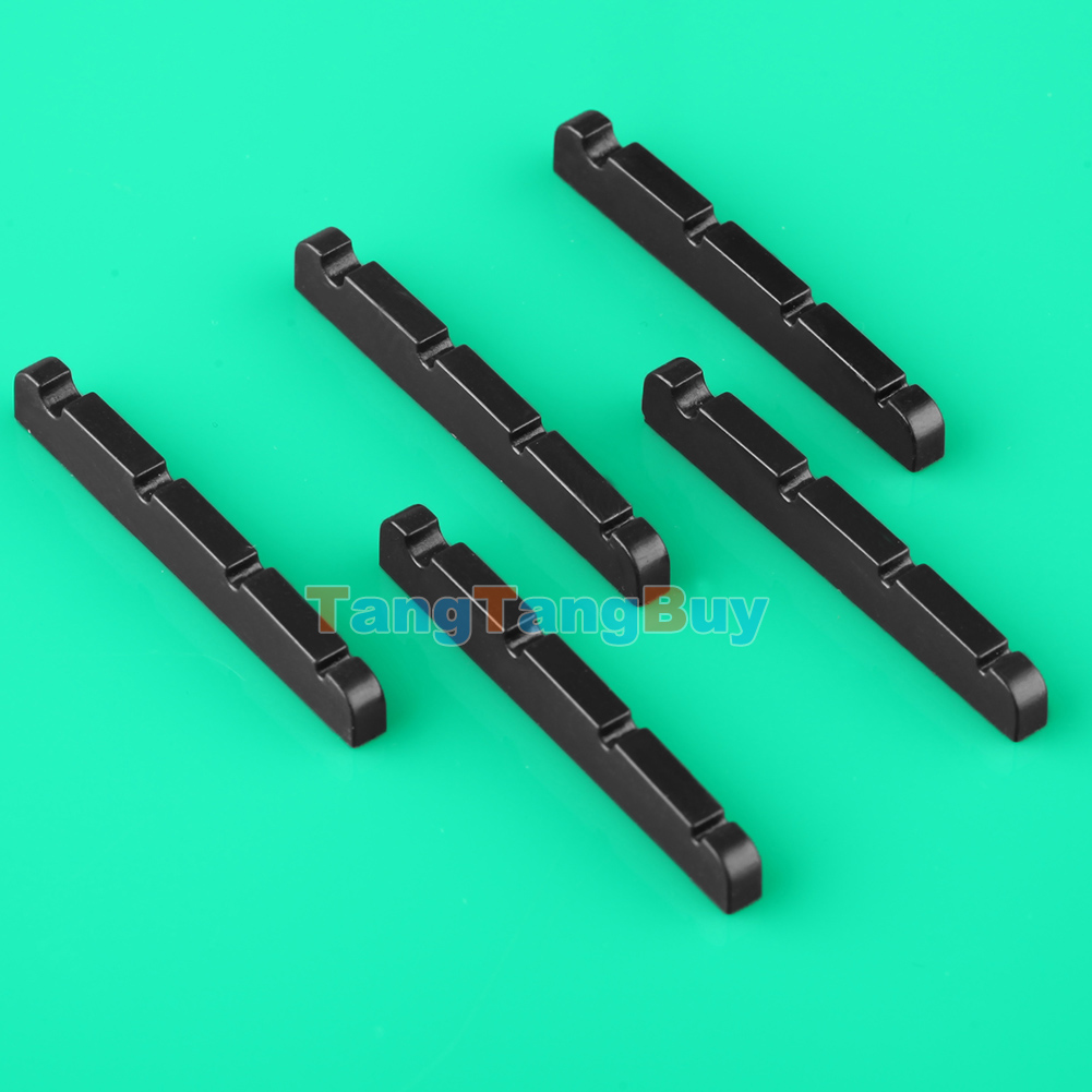 Bass guitar nut slots